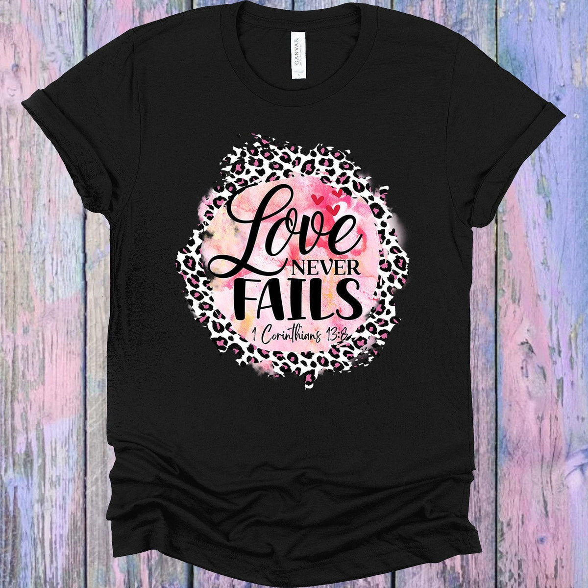 Love Never Fails Graphic Tee product image 1