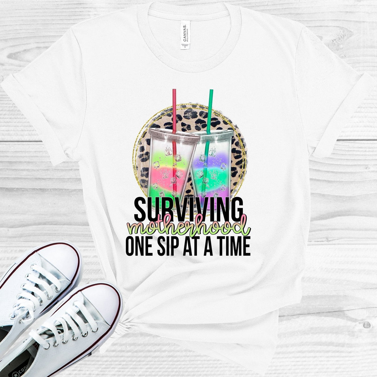 Surviving Motherhood One Sip at a Time Graphic Tee product image 1